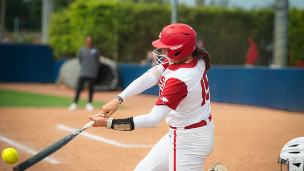 The Arkansas Razorbacks' Spencer Prigge connects on a hit against Penn State at the Paradise Classic in Boca Raton, Florida.